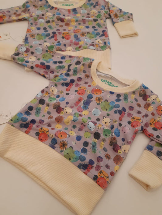 SACO WAMBRAS LILA CON BEIGE ANIMALES